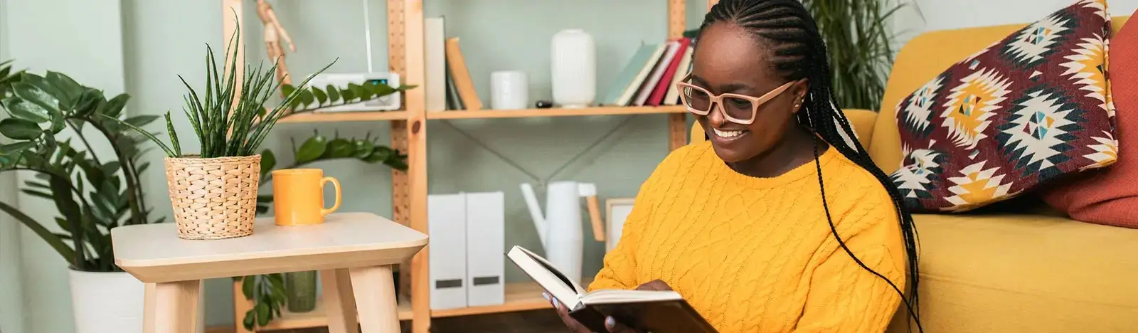 a woman sitting and reading a book